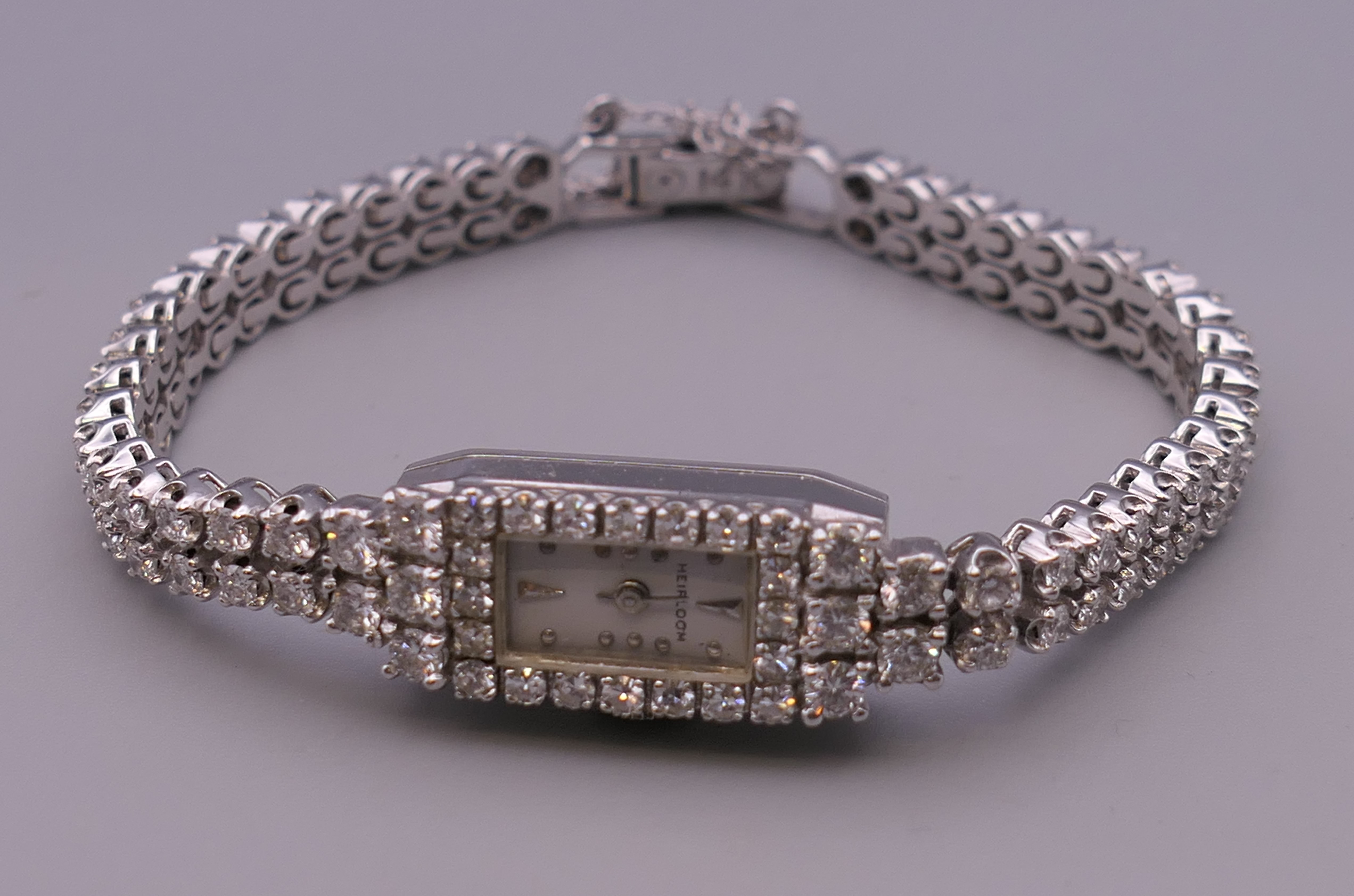 A 14 ct white gold ladies diamond set cocktail watch. 1 cm wide. 24.7 grammes total weight. - Image 2 of 8