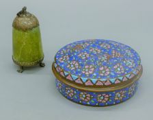 A Middle Eastern circular copper spice box with brightly enamelled lid and tinned interior,