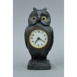 An owl form desk clock. 15.5 cm high.