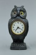 An owl form desk clock. 15.5 cm high.