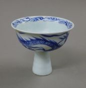 A Chinese blue and white porcelain stem cup. 9 cm high.