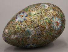 A large cloisonne decorated egg form ornament. 16.5 cm high.