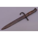 A vintage miniature bayonet. 18.5 cm long.