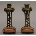 A pair of 19th century bronze and marble candlesticks. 15 cm high.