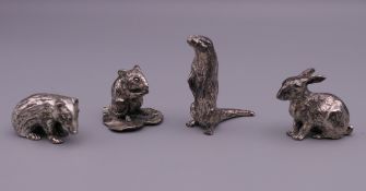 Four silver plated model animals. The largest 4.5 cm high.