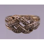 A 9 ct gold diamond set ring. Ring size M. 2.7 grammes total weight.