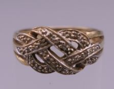 A 9 ct gold diamond set ring. Ring size M. 2.7 grammes total weight.