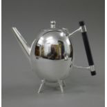 A Christopher Dresser style teapot. 18 cm high.