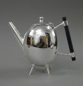 A Christopher Dresser style teapot. 18 cm high.