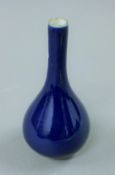 A small Chinese blue porcelain straight neck vase. 15 cm high.