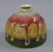 A Chinese drip glazed porcelain beehive brush pot. 9 cm high.