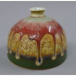 A Chinese drip glazed porcelain beehive brush pot. 9 cm high.