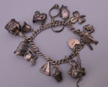 A silver charm bracelet. 39.9 grammes.