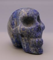 A lapiz model of a skull. 6 cm high.