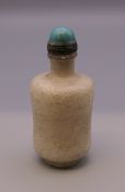 A hardstone turquoise topped snuff bottle. 7.5 cm high.