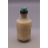 A hardstone turquoise topped snuff bottle. 7.5 cm high.