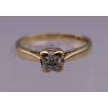 A gold diamond solitaire ring. Ring size H.