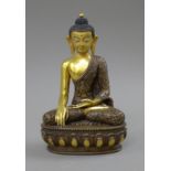 A painted face bronze model of Buddha. 21.5 cm high.