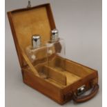 Two bottles housed in a leather case. The case 20 cm wide.
