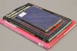 Three Oriental carpet books.