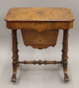 A Victorian inlaid burr walnut work table. 60.5 cm wide.