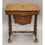 A Victorian inlaid burr walnut work table. 60.5 cm wide.