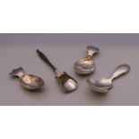 Four silver caddy spoons. 33.3 grammes total weight.