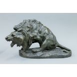 ANTONIO AMORCASTI (1880-1942), a bronze patinated plaster model of a lion. 28 cm high.