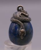 A silver and lapiz egg form pendant. 3 cm high.