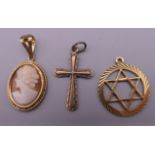 Two 9 ct gold pendants and a 9 ct gold cameo pendant. 3.5 grammes total weight.