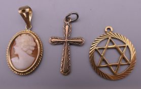 Two 9 ct gold pendants and a 9 ct gold cameo pendant. 3.5 grammes total weight.