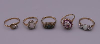 Five 9 ct gold stone set rings. 9.9 grammes total weight.