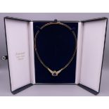 A 14 K gold tanzanite and diamond set necklace. 35.3 grammes total weight.