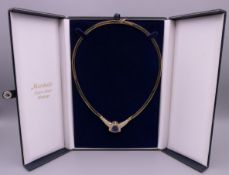 A 14 K gold tanzanite and diamond set necklace. 35.3 grammes total weight.