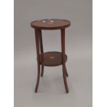 An Edwardian inlaid mahogany two tier side table. 55 cm high.