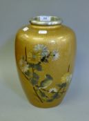 A large Japanese bronze gold splash vase decorated with a bird in foliage. 29 cm high.