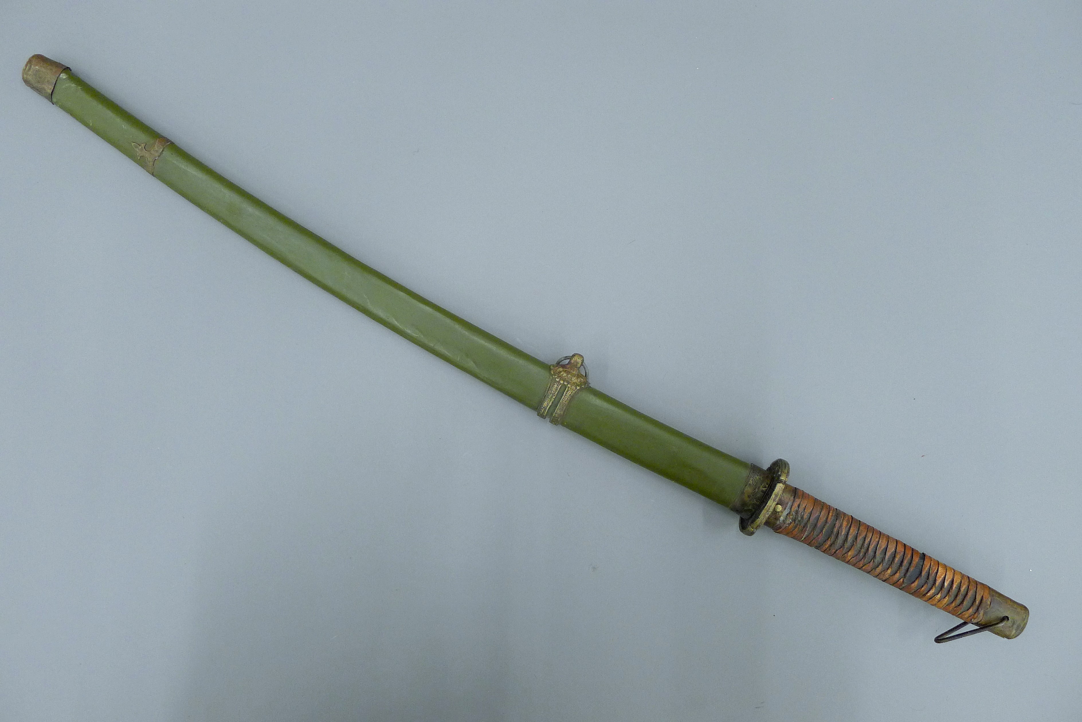 A 20th century Japanese Katana sword, in painted metal scabbard. 93 cm long overall.