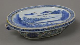 An 18th century Chinese blue and white porcelain warming plate. 19.5 cm wide.