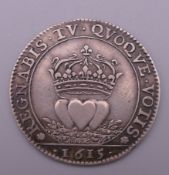 A Spanish coin, dated 1615. 2.75 cm diameter. 4.9 grammes.