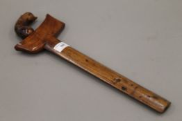 A Sumatran kris dagger with carved hardwood handle and sheath. 43 cm long.