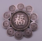 A Chinese silver brooch. 5 cm diameter.