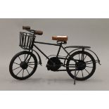 A model of a 1930's delivery bike. 38 cm long.