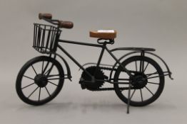 A model of a 1930's delivery bike. 38 cm long.