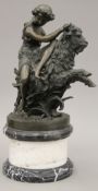 A bronze model of a girl riding a goat, on a marble plinth base. 51 cm high.