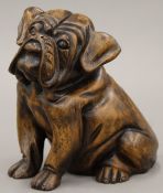 A carved wooden figure of a bull dog. 18 cm high.