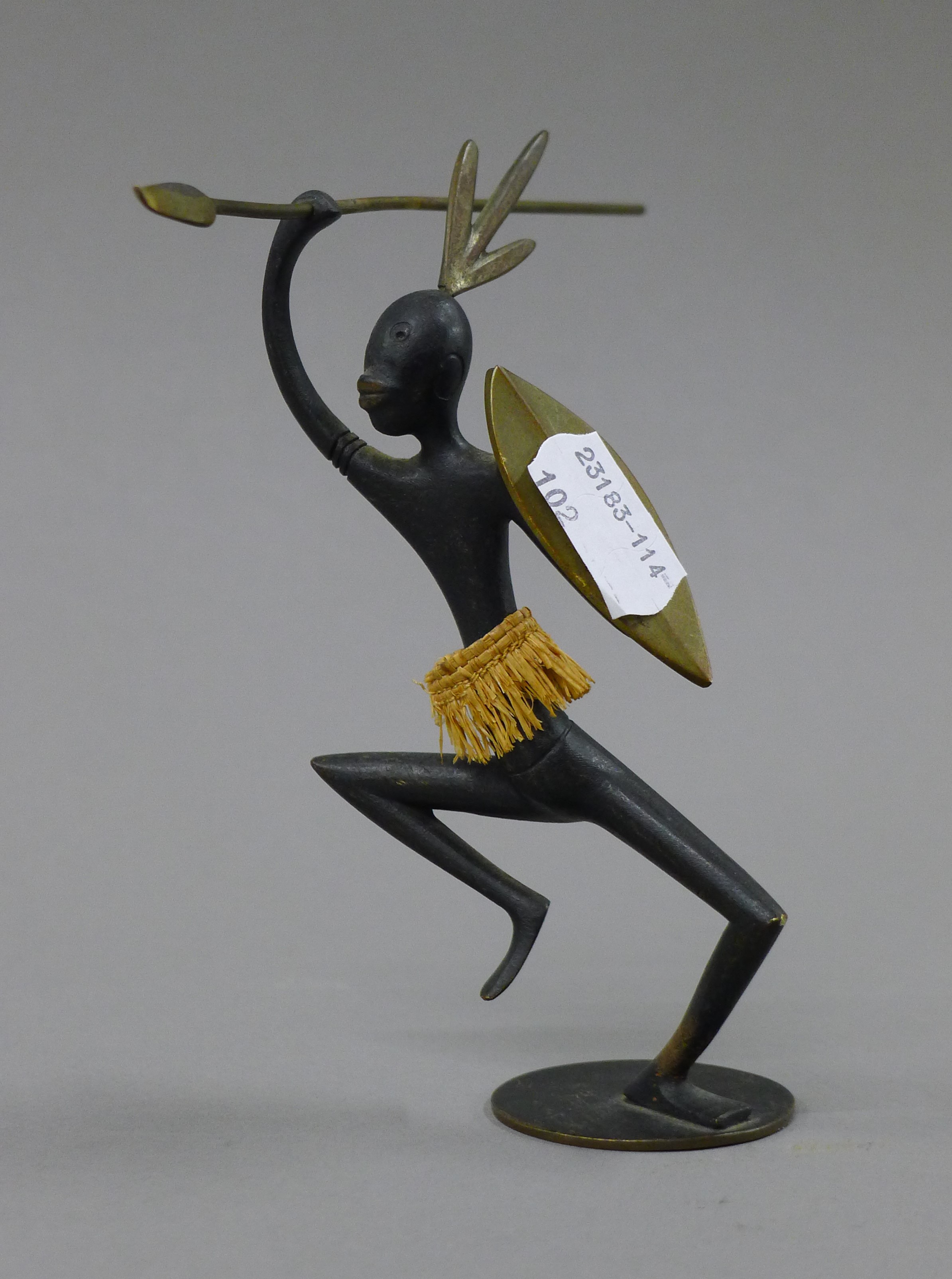A Hagenauer bronze model of an African figure. 13.5 cm high.