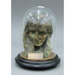 A plaster bust under a glass dome of Elizabeth Barrett Browning,