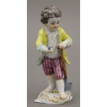 A Meissen porcelain figure of a gardener. 11.5 cm high.