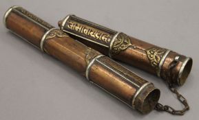 A Tibetan copper and brass scroll holder. 37 cm long.