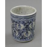 A Chinese blue and white porcelain brush pot. 12 cm high.